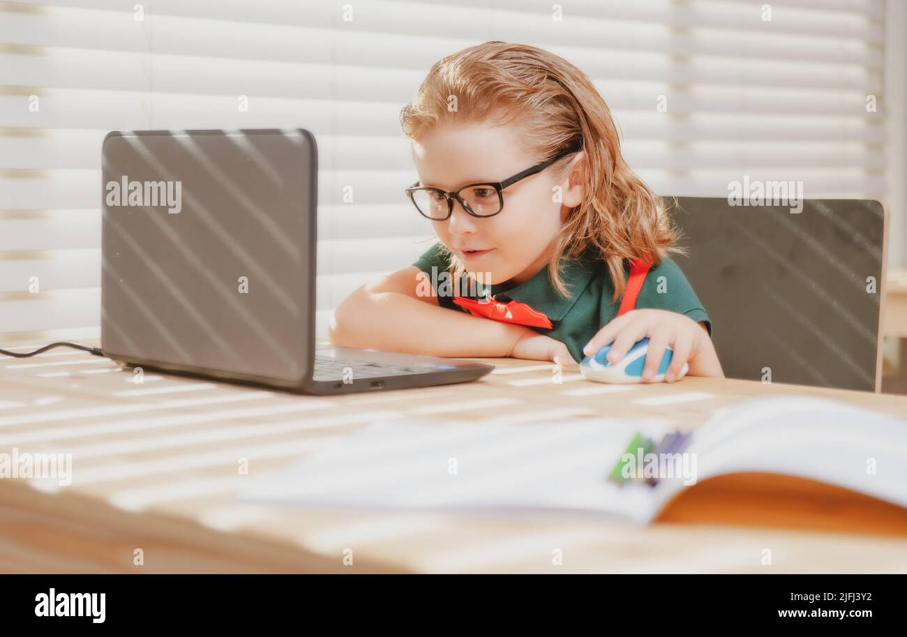 Schoolboy studying homework math during her online lesson at home ...
