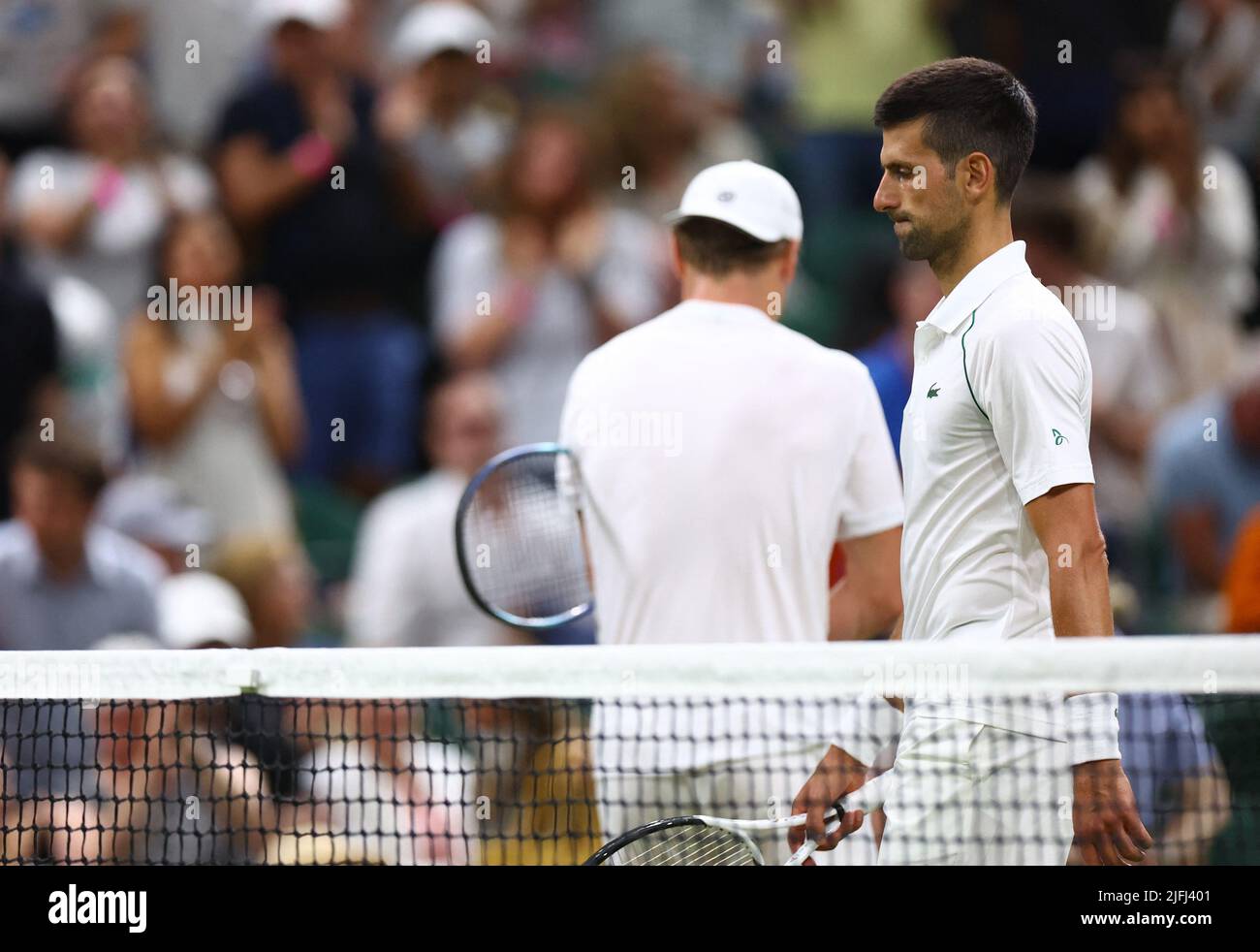 Tennis - Wimbledon - All England Lawn Tennis and Croquet Club, London, Britain - July 3, 2022 Serbia's Novak Djokovic and Netherlands' Tim van Rijthoven during their fourth round match REUTERS/Hannah Mckay Stock Photo