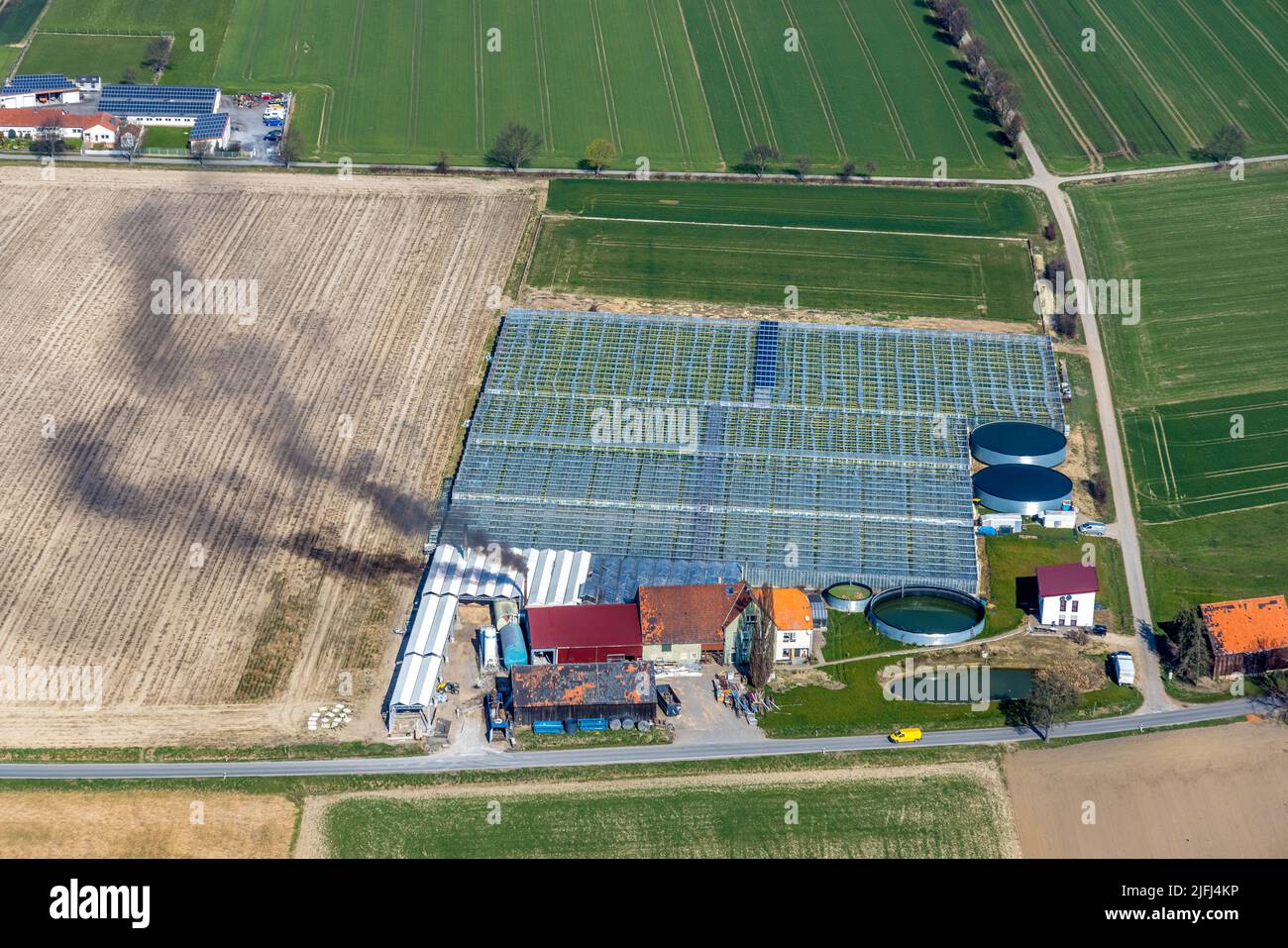 Aerial view, agricultural company Gartenbau Stemann, Werl, Soester Börde, smoke, fumes, pollution, chimney, North Rhine-Westphalia, Germany, DE, Europ Stock Photo