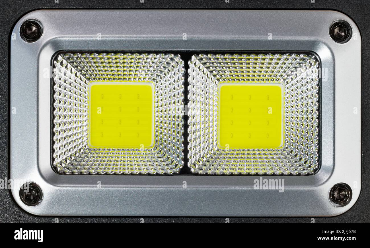 High power photographic electric LED lamp in plastic reflective surface. Closeup of professional reflector of light emmiting diodes. Electrotechnology. Stock Photo