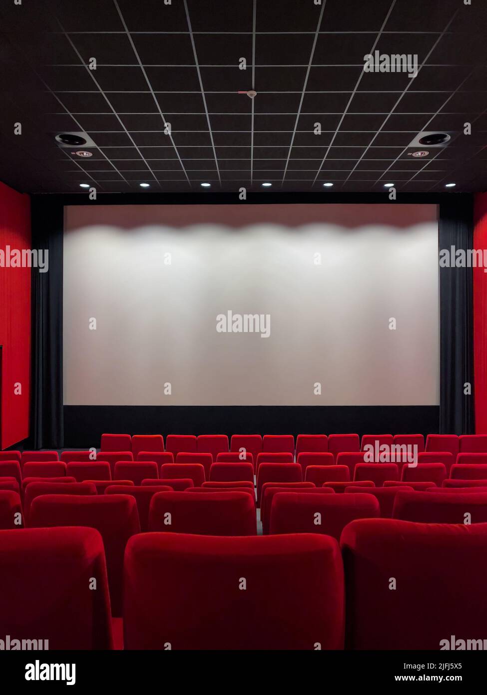 Cinema Screen And Red Seats. Empty Screening Theater Stock Photo - Alamy
