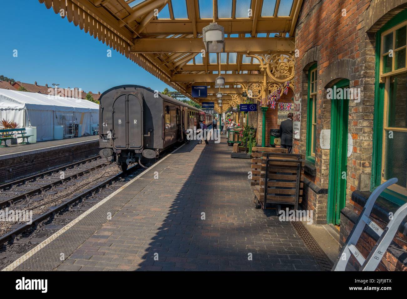 Passengers and tourist on the platform at the historic railway station at Sheringham which is part of the North Norfolk railway. Stock Photo