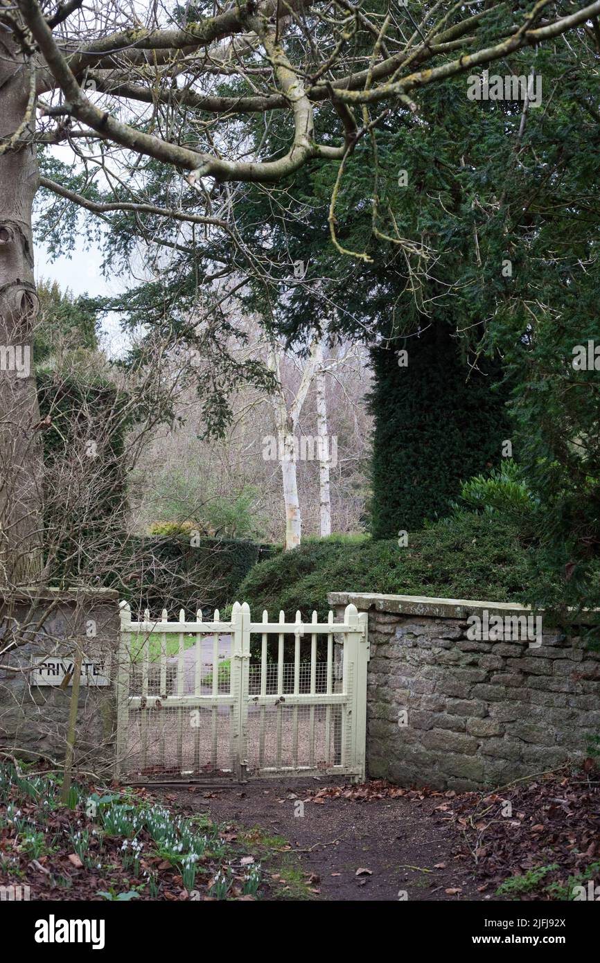 Gates with a private sign between a country church and the hall big house Settrington North Yorkshire UK Stock Photo