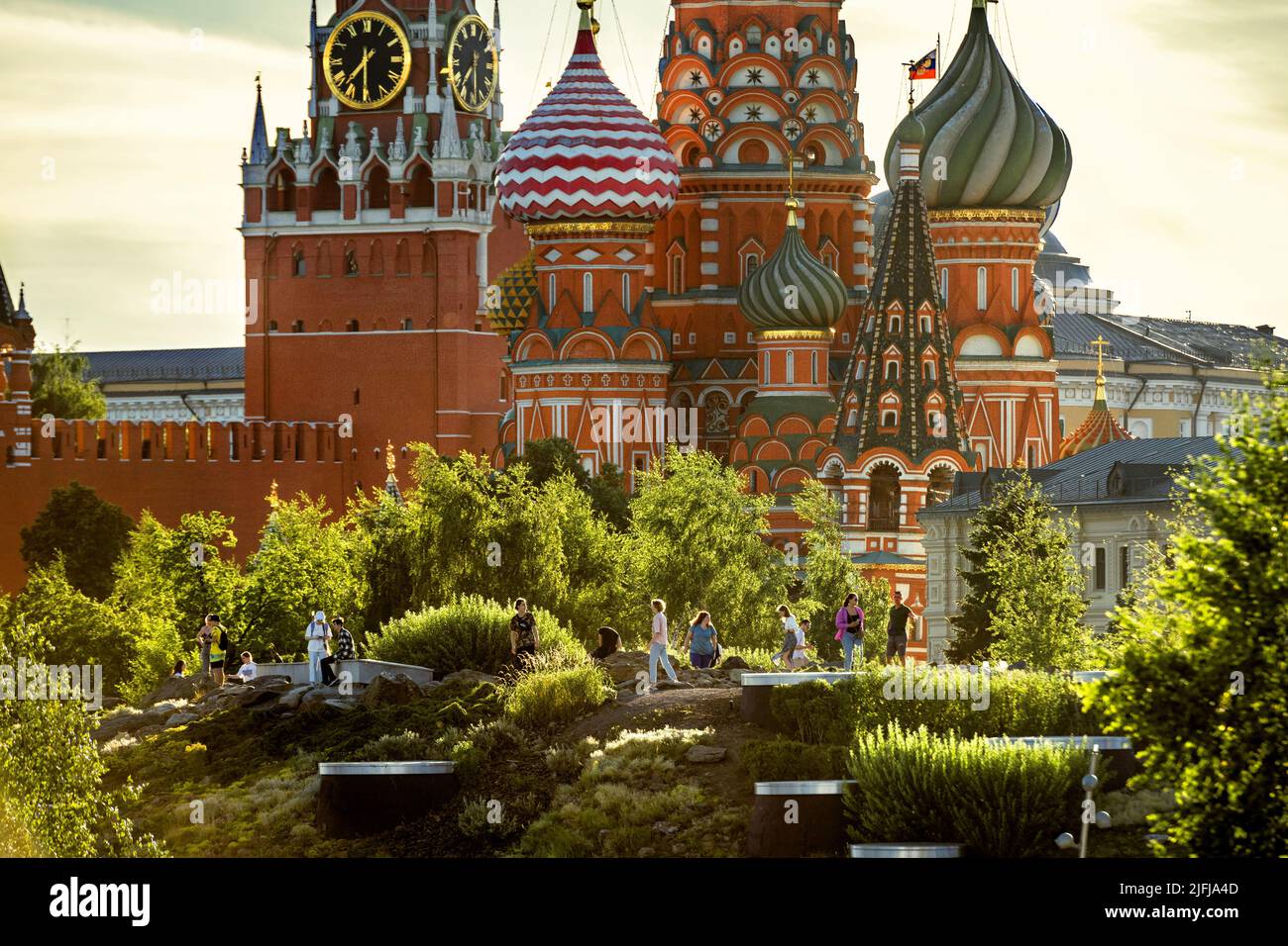 Moscow - Jun 28, 2022: People near St Basil Cathedral and Kremlin in Zaryadye Park, Moscow, Russia. Landscaped Zaryadye Park is tourist attraction of Stock Photo