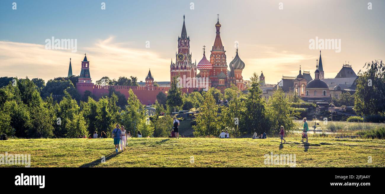 Moscow - Jun 28, 2022: People walk near St Basil Cathedral and Kremlin in Zaryadye Park, Moscow, Russia. This nice park is tourist attraction of Mosco Stock Photo