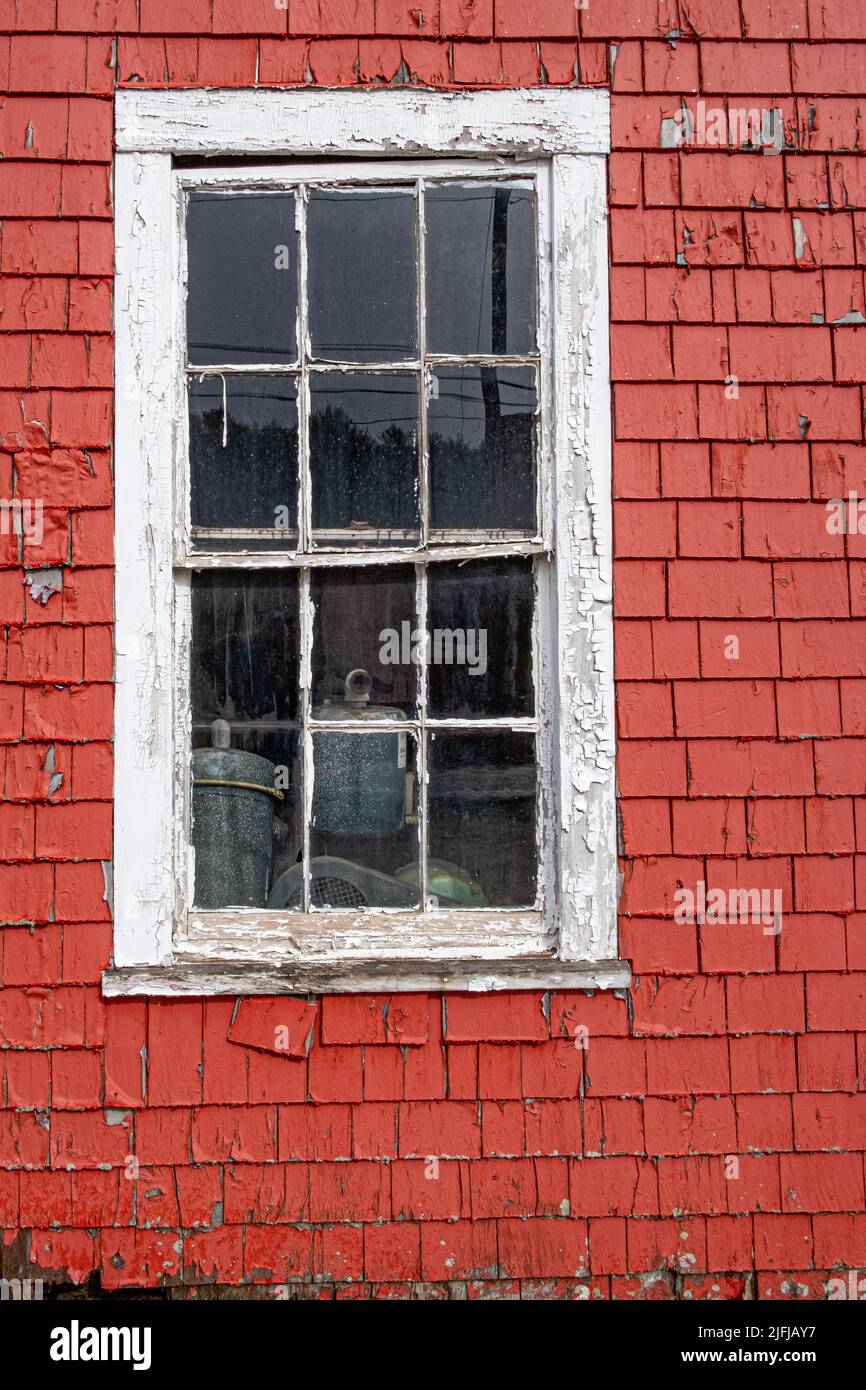 A window on the side of an old barn Stock Photo