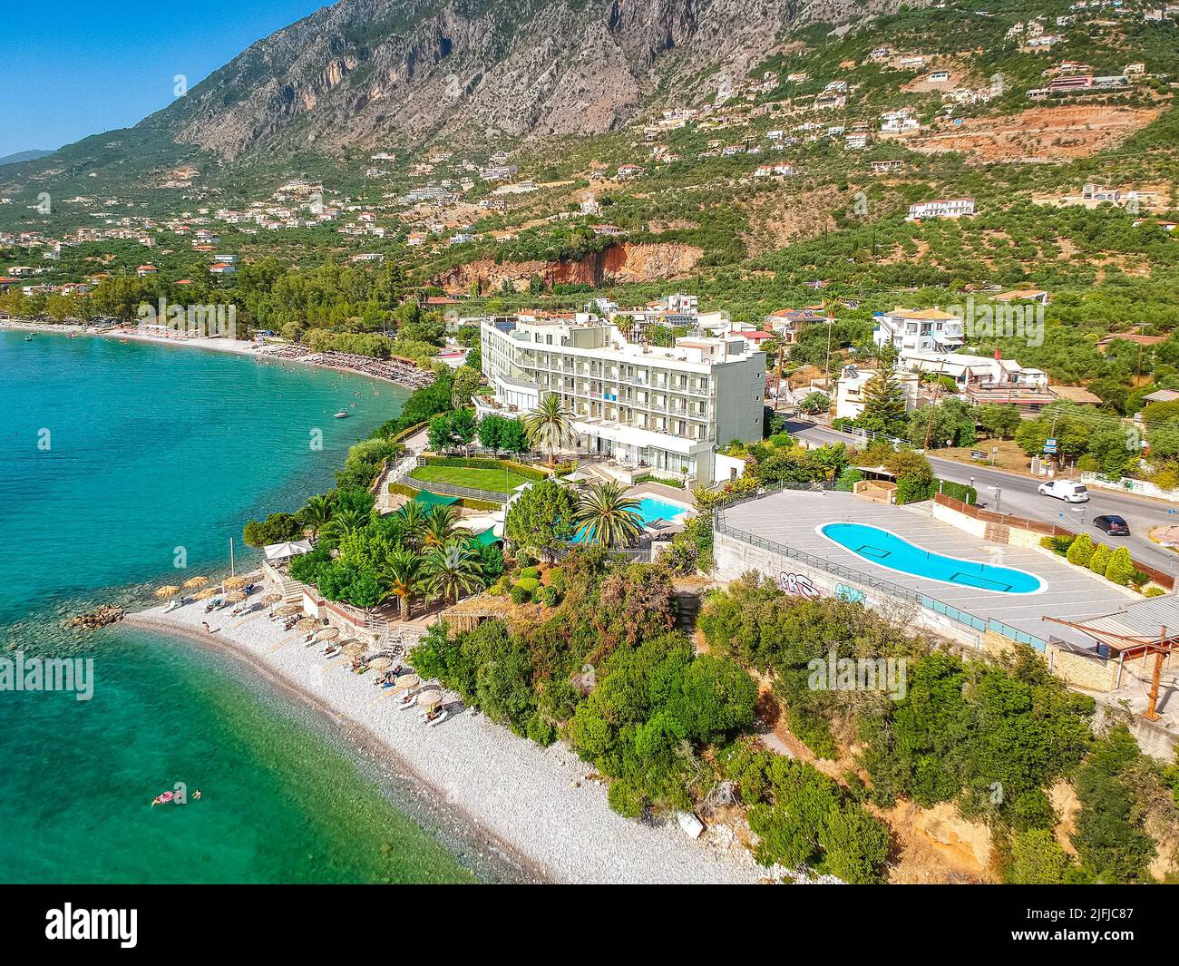 Aerial view over Almyros beach with luxurious hotels and resorts in Kato verga kalamata, Greece. Stock Photo
