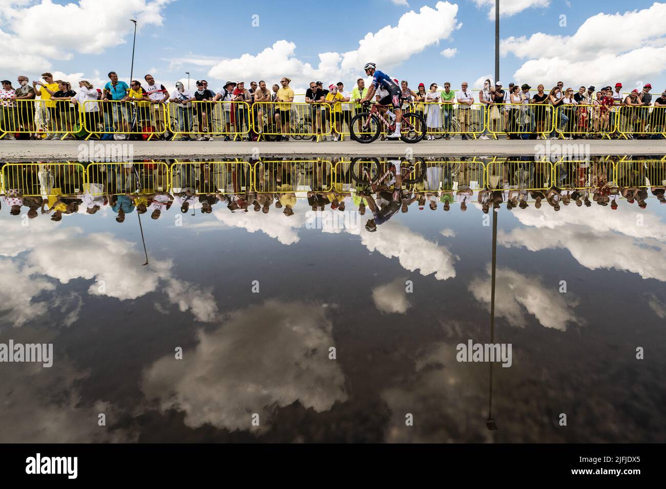 Vejle to Sonderborg, Denmark. 3rd July, 2022. Tour de France 2022, Stage 3 Stage 3 Vejle to Sonderborg, Mathieu Van Der Poel for team Alpecin Deceuninck rides to the the team buses in front of a puddle. Credit: Peter Goding/Alamy Live News Stock Photo