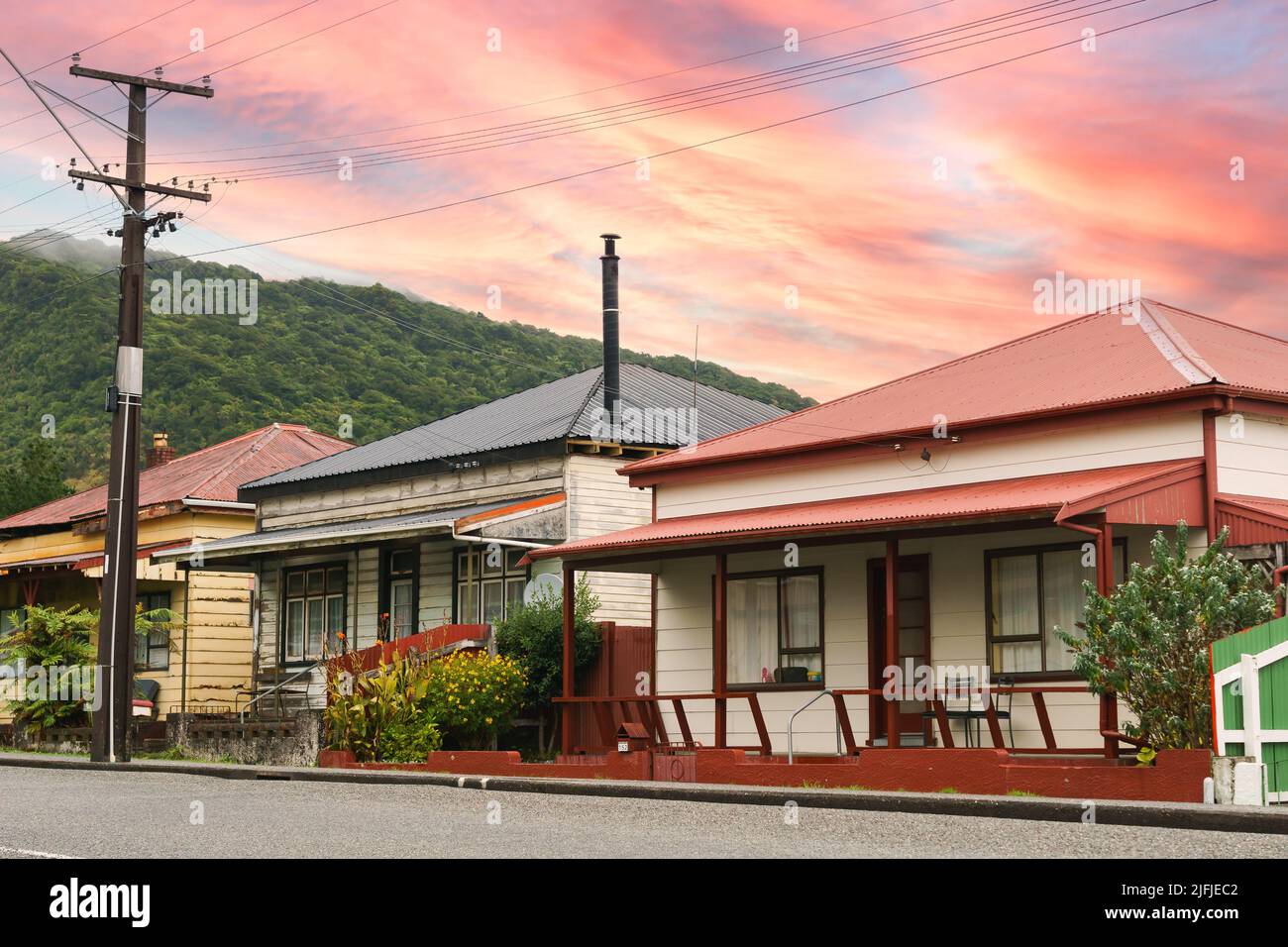 Street view of Old heritage style homes with veranda and entrance on street in Cobden Greymouth, New zealand. Stock Photo