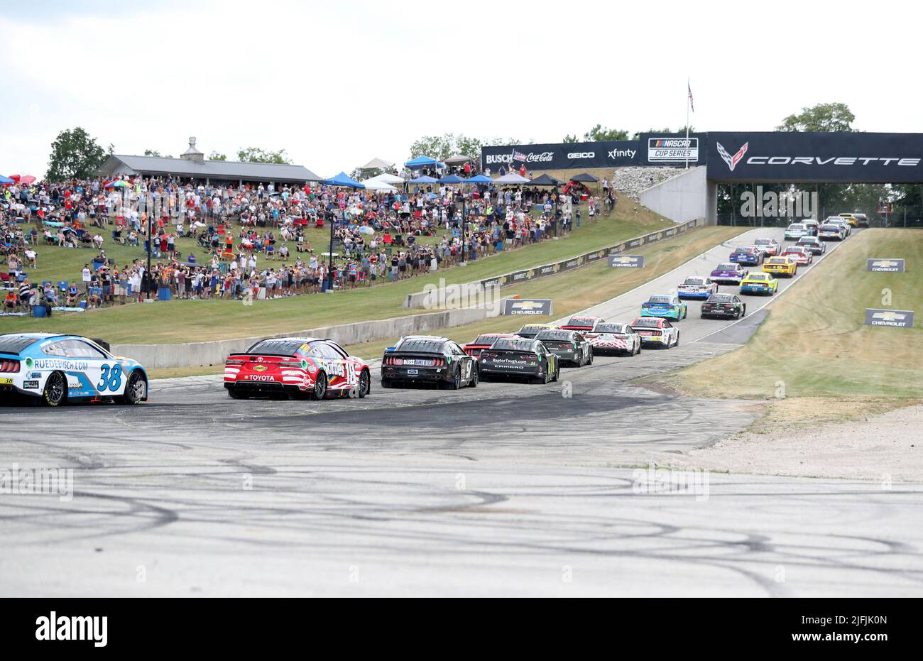 Plymouth, Wisconsin, USA. 3rd July, 2022. The field of cars make Turn 5 as the crowd watches during the NASCAR Cup Series Kwik Trip 250 at Road America on July 03, 2022 in Plymouth, Wisconsin. Ricky Bassman/Cal Sport Media/Alamy Live News Stock Photo