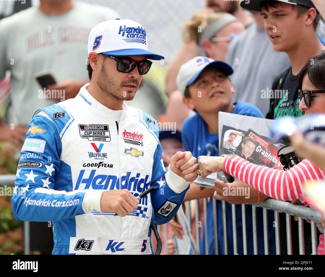July 3, 2022: Kyle Larson, driver of the #5 HendrickCars.com Chevrolet, fist bumps the crowd before the NASCAR Cup Series Kwik Trip 250 at Road America on July 03, 2022 in Plymouth, Wisconsin. Ricky Bassman/Cal Sport Media Stock Photo
