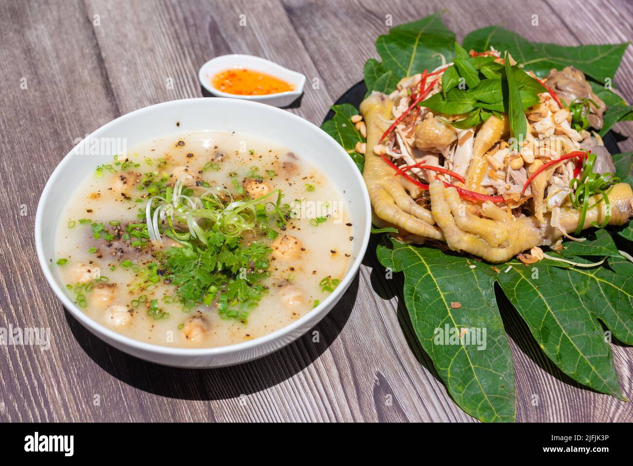 Chicken porridge is cooked from lightly roasted rice, then the rice is really soft. Porridge ingredients include rice, shiitake mushrooms, vegetables Stock Photo