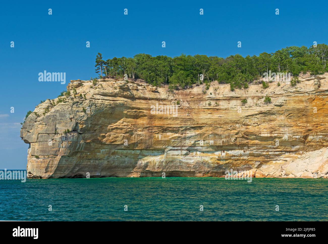 Massive Sandstone Cliffs on the Lakeshore in Lake Superior in Pictured Rocks National Lakeshore in Michigan Stock Photo