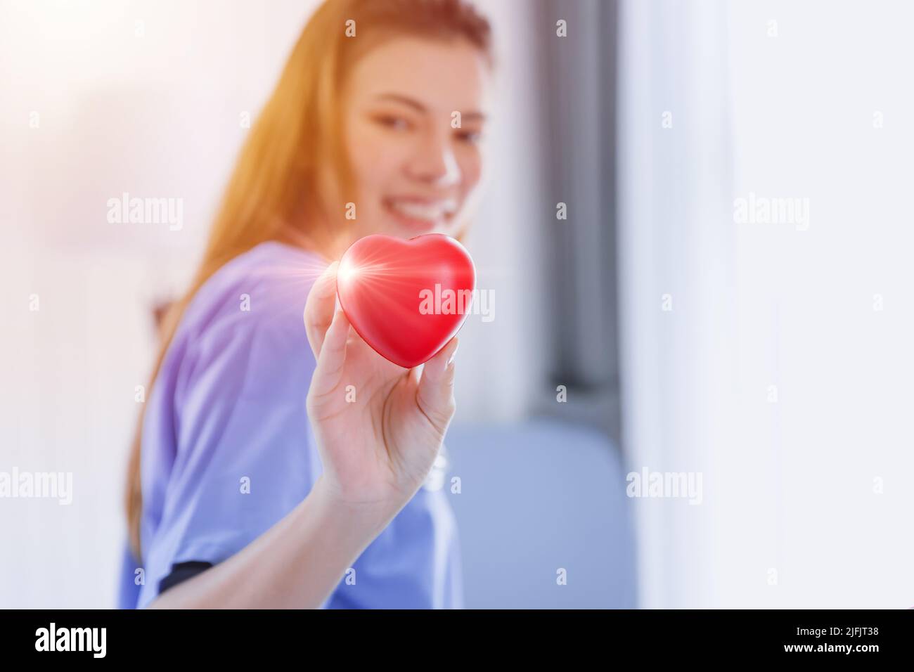 Heart Love Cardio Healthcare Medical concept with Beautiful Nurse Happy Smile. Stock Photo