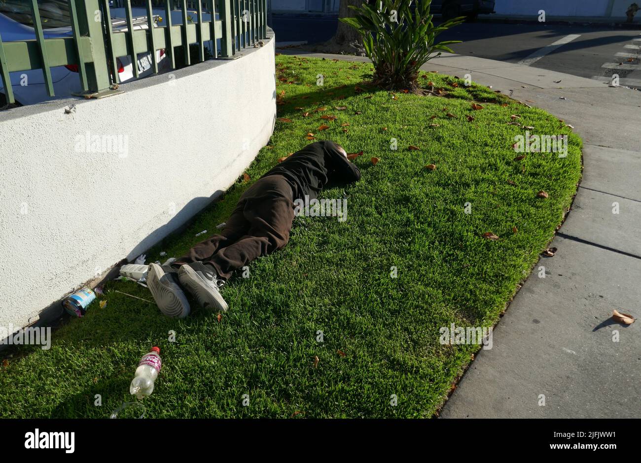 Los Angeles, California, USA 19th June 2022 A general view of atmosphere of Homeless man sleeping on street on June 19, 2022 in Los Angeles, California, USA. Photo by Barry King/Alamy Stock Photo Stock Photo