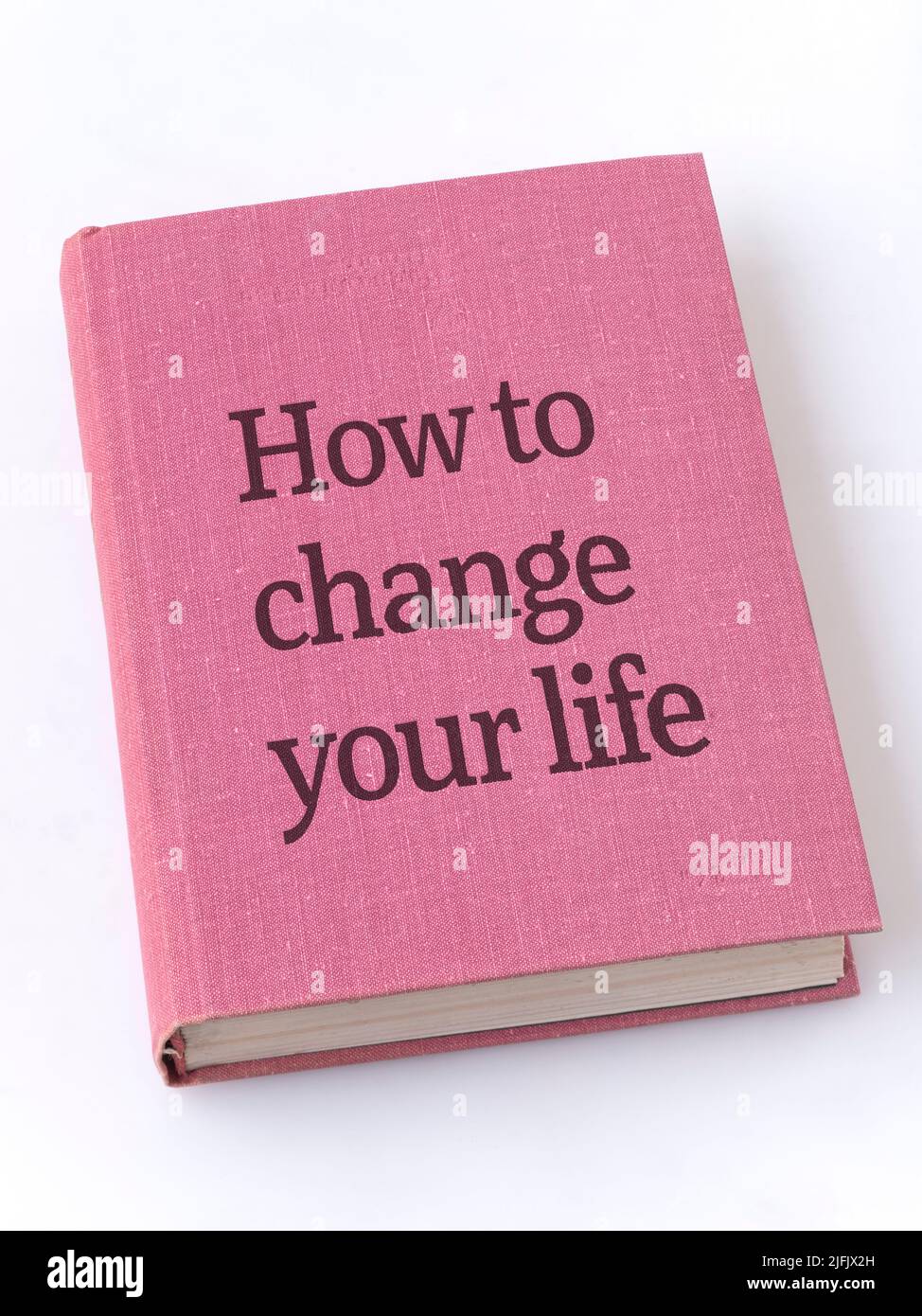 how to change your life phrase printed on textile book cover Stock Photo