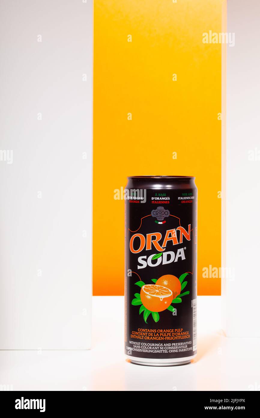 Prague, Czech Republic - 7, June 2022: One can of Orange Soda fruit mineral water on the orange background Stock Photo