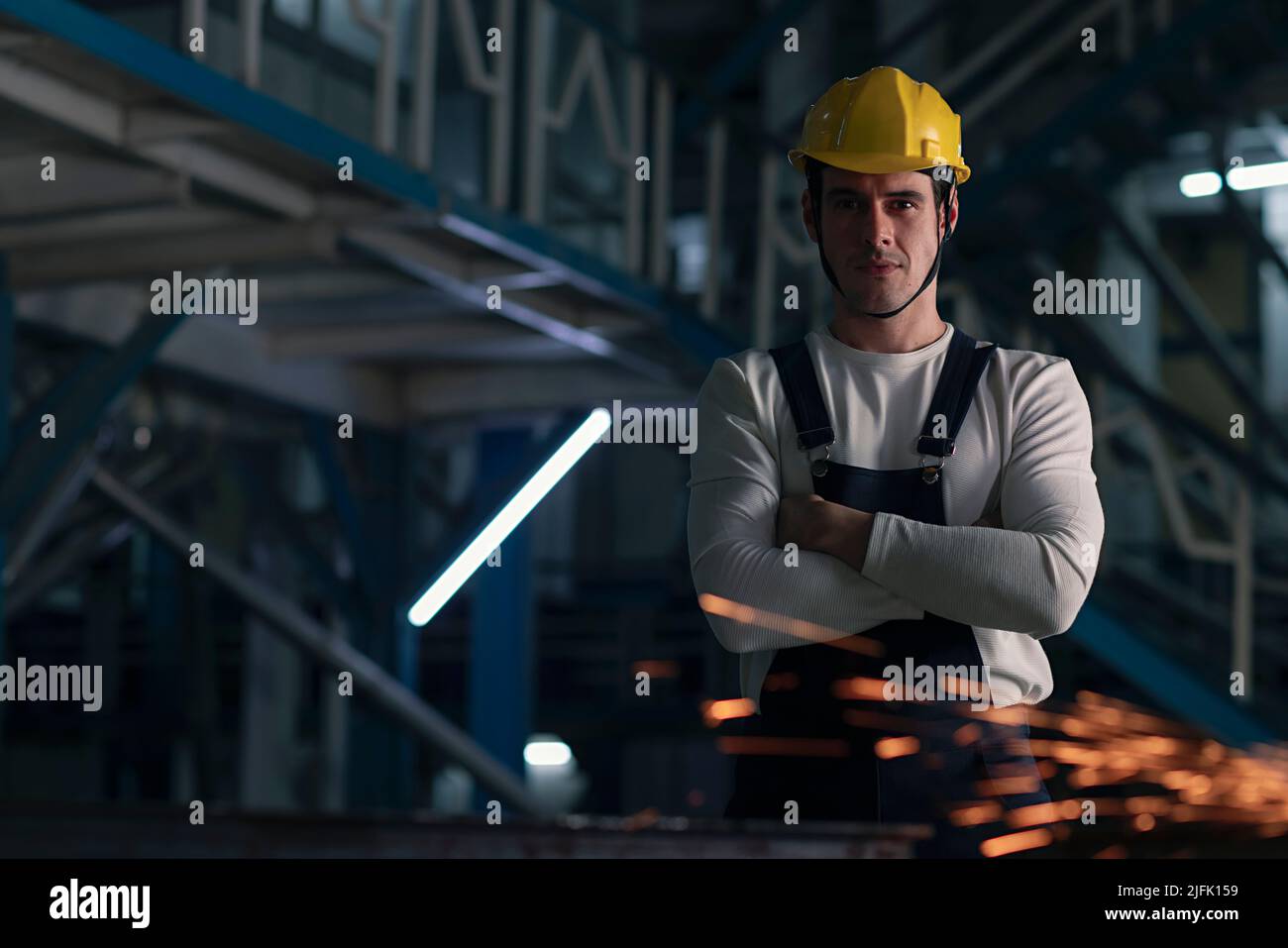 Portrait of a mid adult man standing in the factory Stock Photo