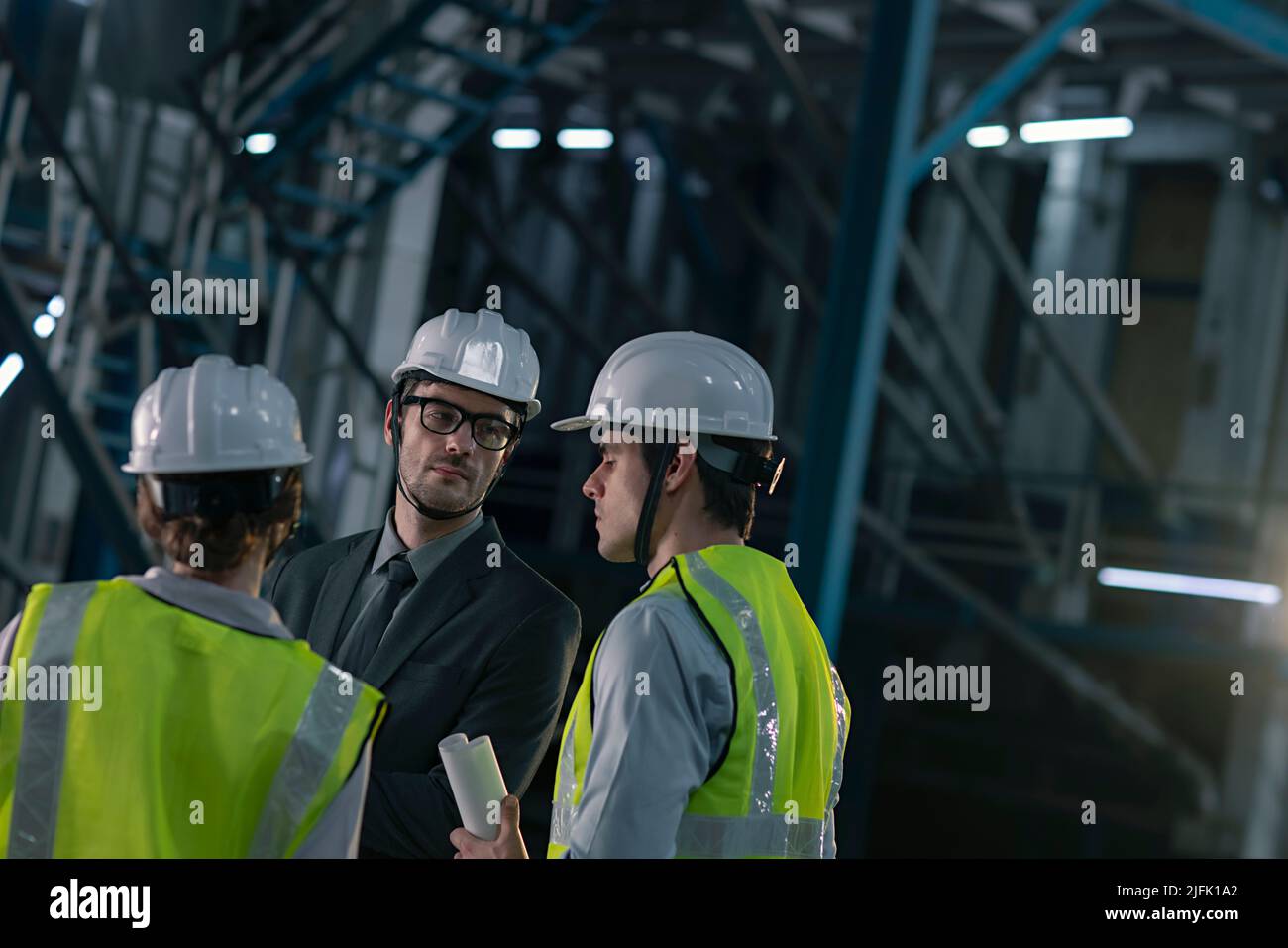 Businessman in meeting with his employee in the factory Stock Photo