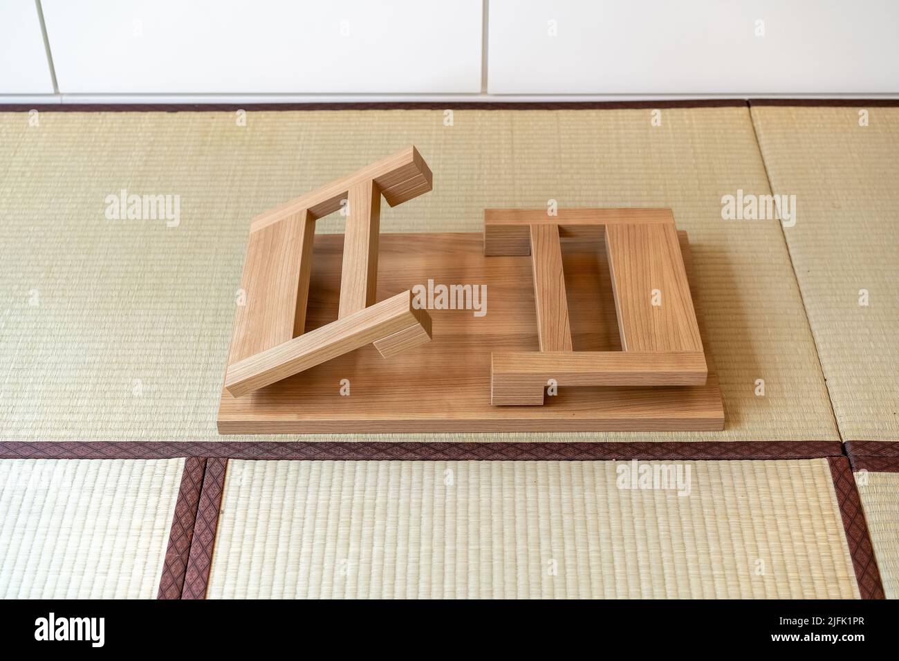 A Japanese folding table made of wood is set at the center of the picture,  suitable for eating or reading, on tatami mats Stock Photo - Alamy