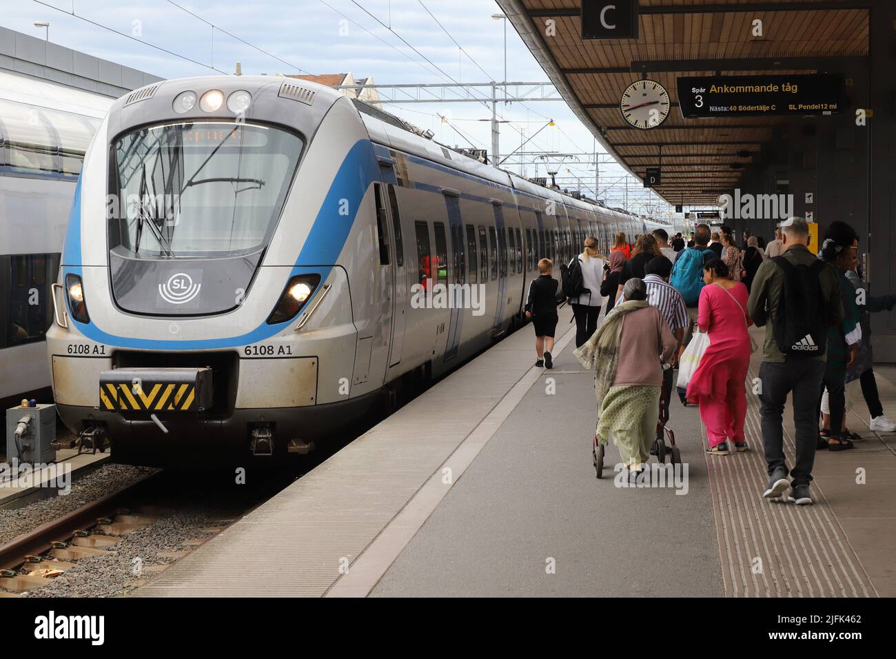 Uppsala, Sweden - July 2, 2022: Arriving SL commuter train class X60 at the Uppsala Central station. Stock Photo