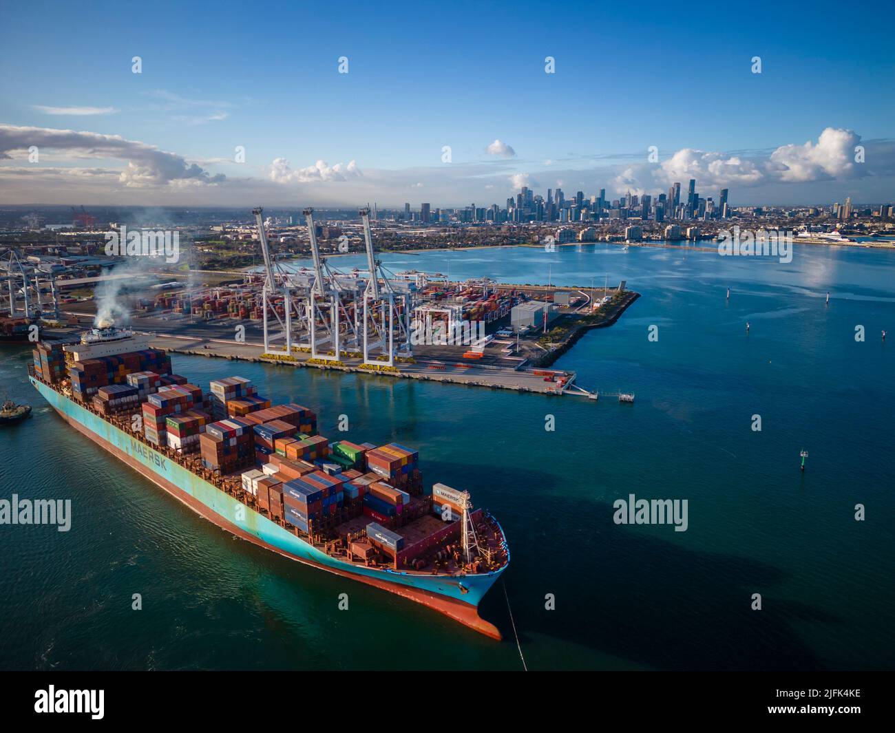 Melbourne, Australia - Jun 29, 2022: Aerial view of container ship departing from Port of Melbourne Stock Photo