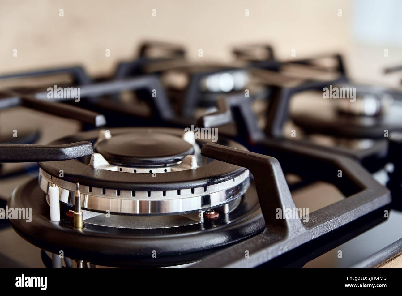 New kitchen stove with gas hob, close up. Modern kitchen appliance