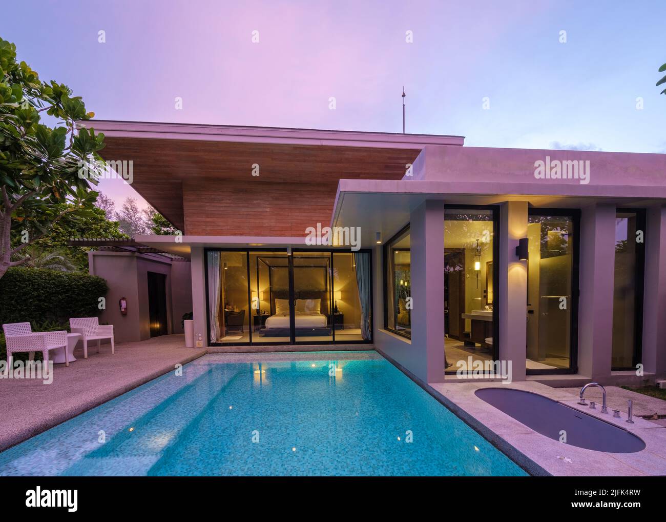 Modern house with a swimming pool, modern pool villa at the beach