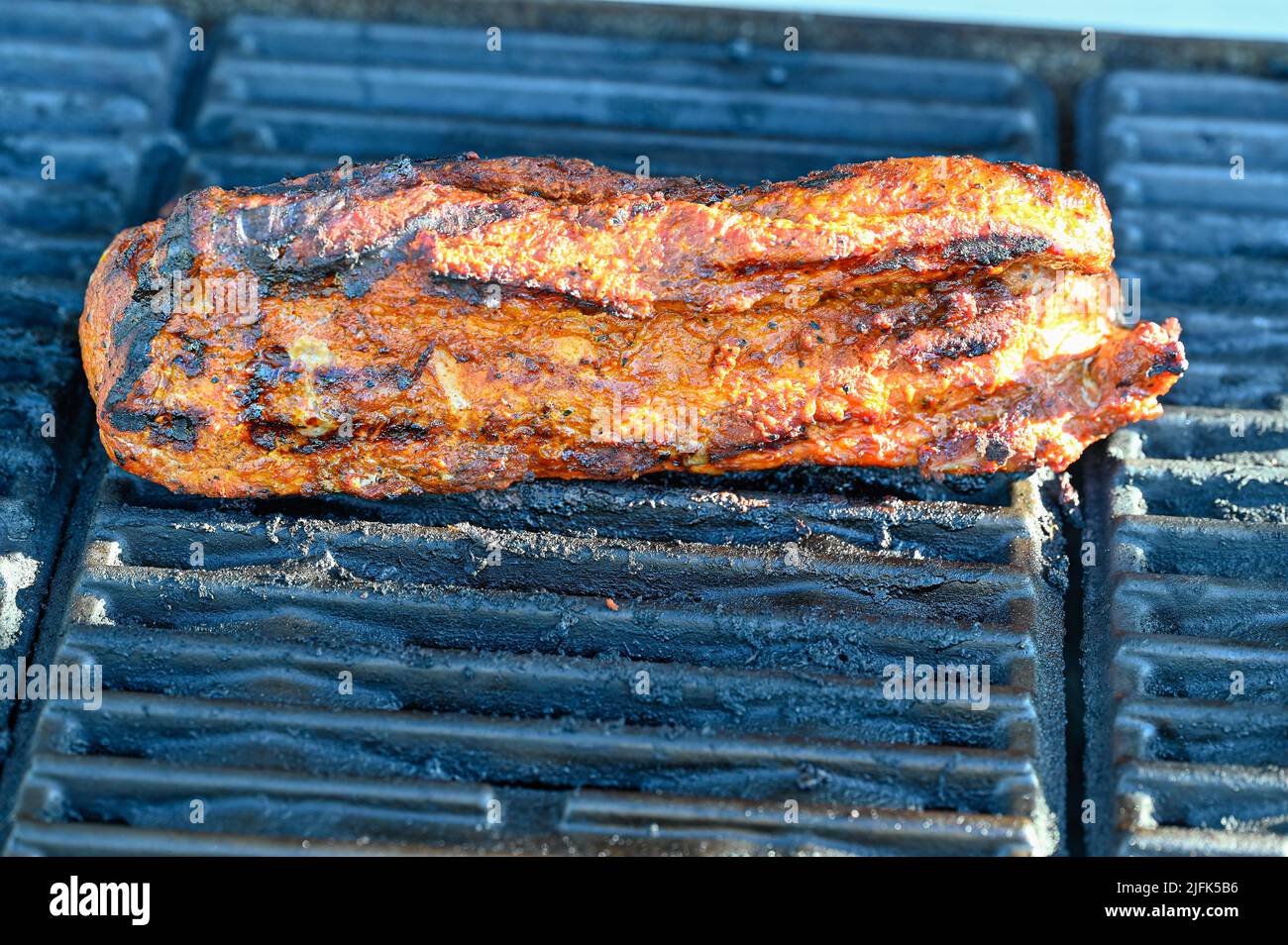 BBQ pork tenderloin a beautiful evening in Sweden Stock Photo