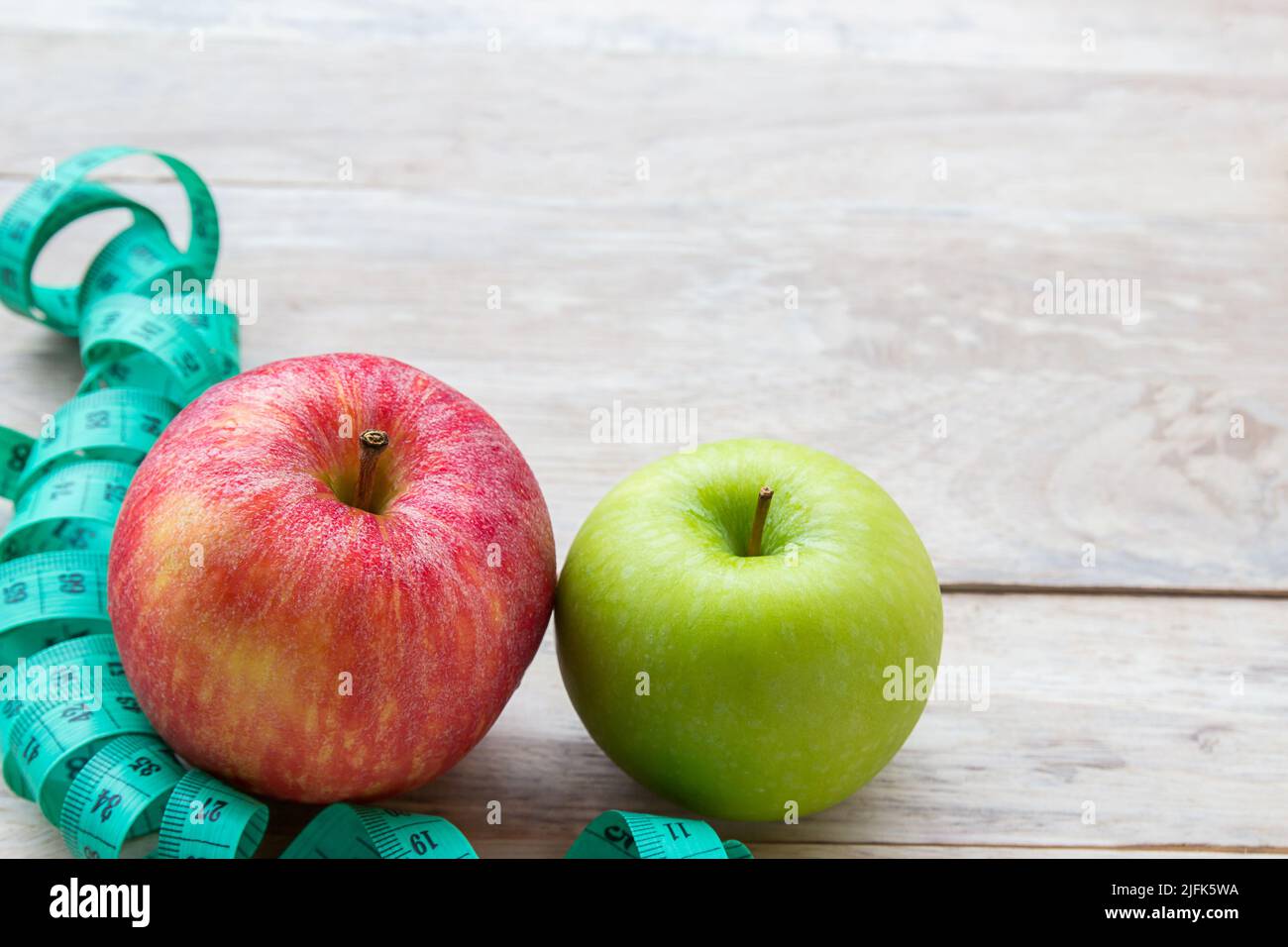Healthy lifestyle concept with apples. Weight loss or diet concept. Red