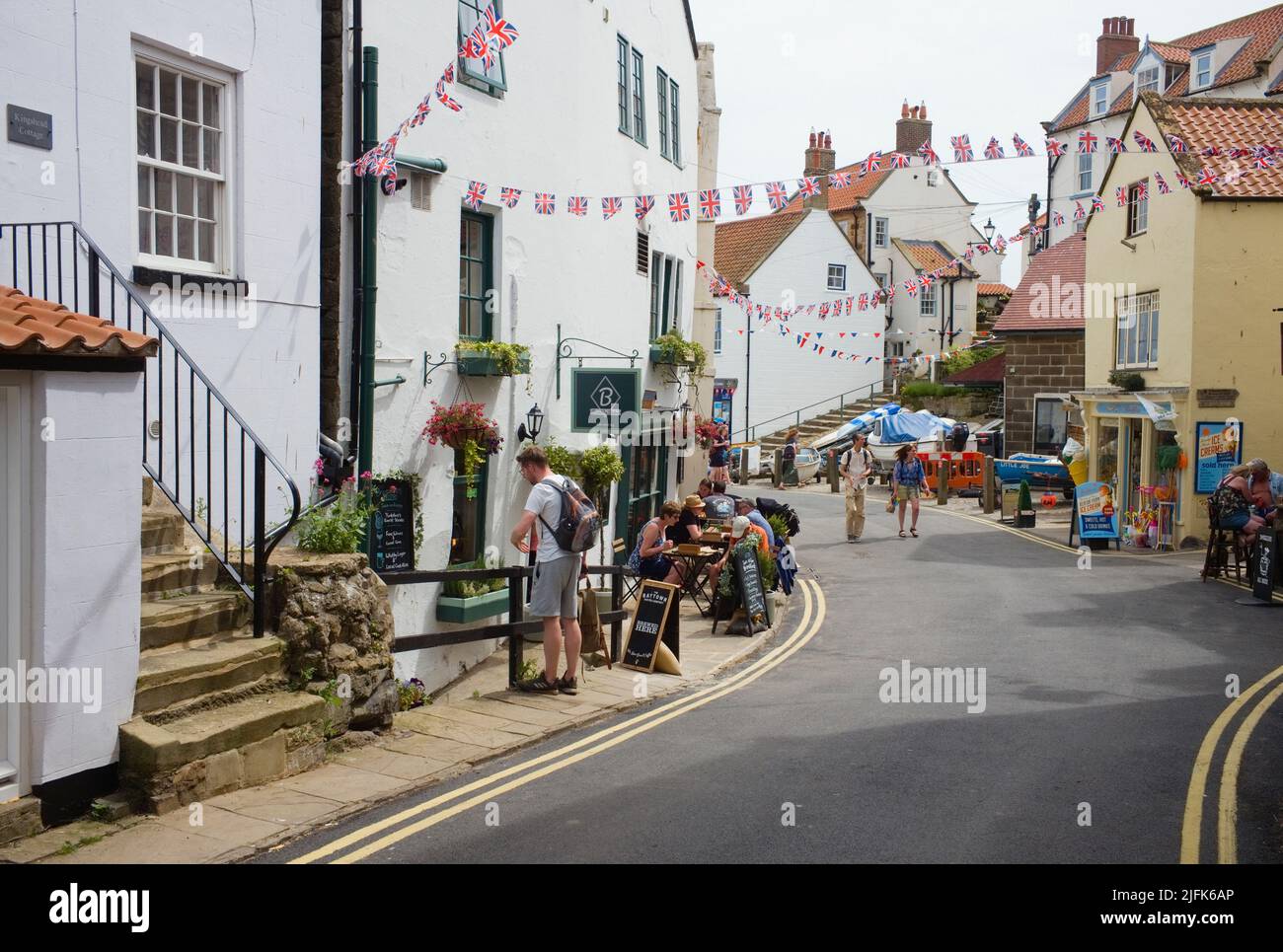 The main street down to the beach at Robin Hood's Bay, North Yorkshire Stock Photo