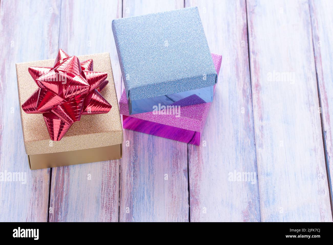 Christmas and happy new year gift box and red ribbon with tag on wood ...