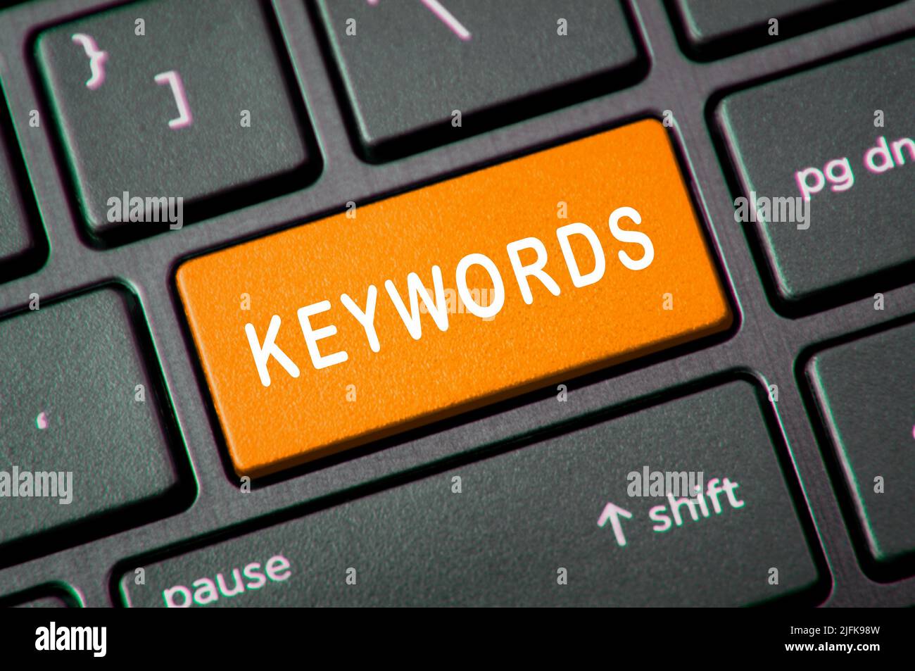 Keywords text of Laptop Keyboard Key. Online keywords concept Stock Photo