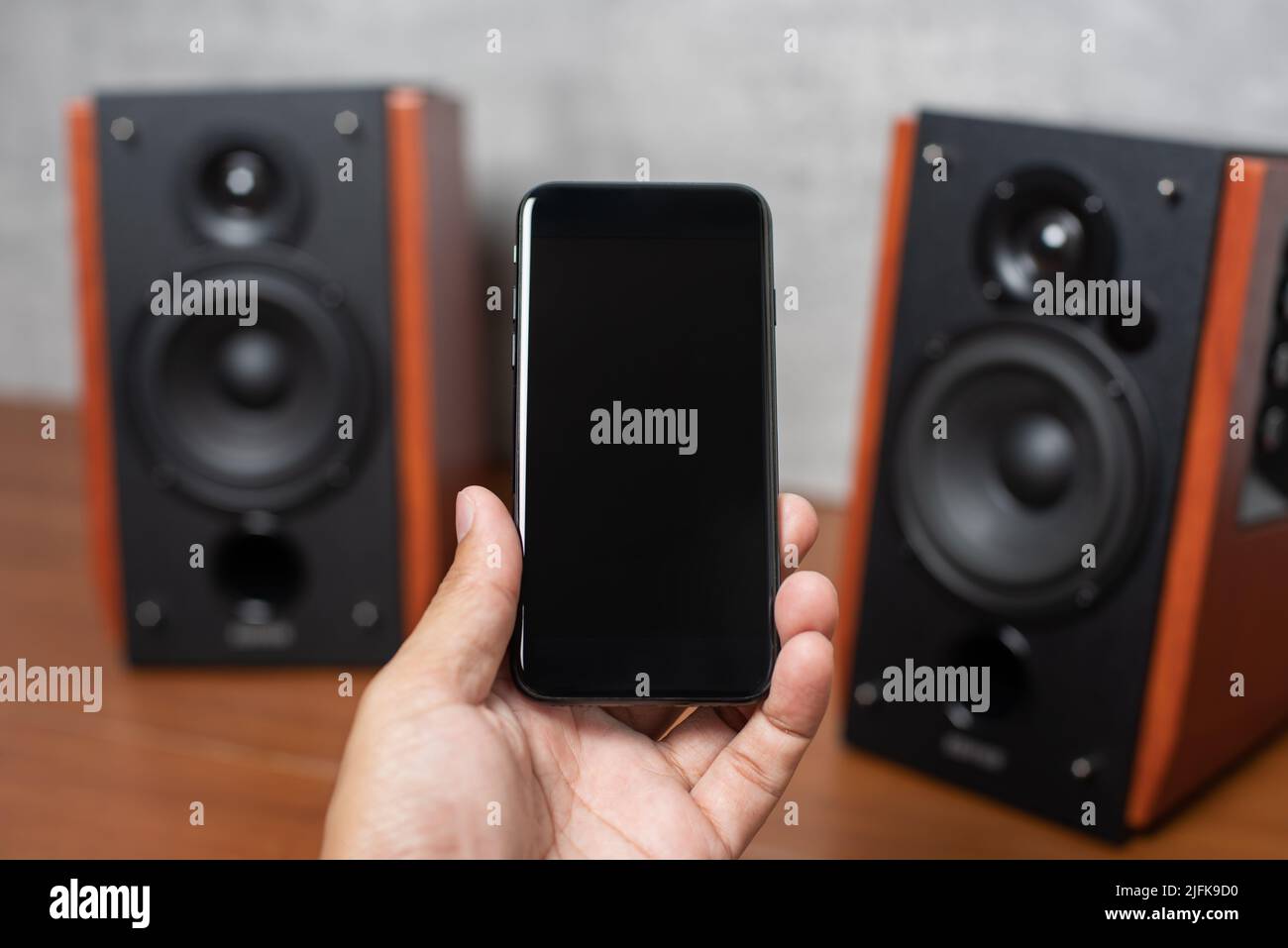 Playing song on bluetooth speaker from smartphone. Home entertainment