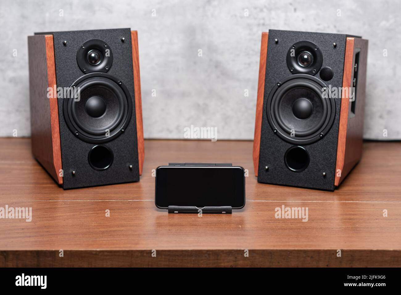 Playing song on bluetooth speaker from smartphone. Home entertainment