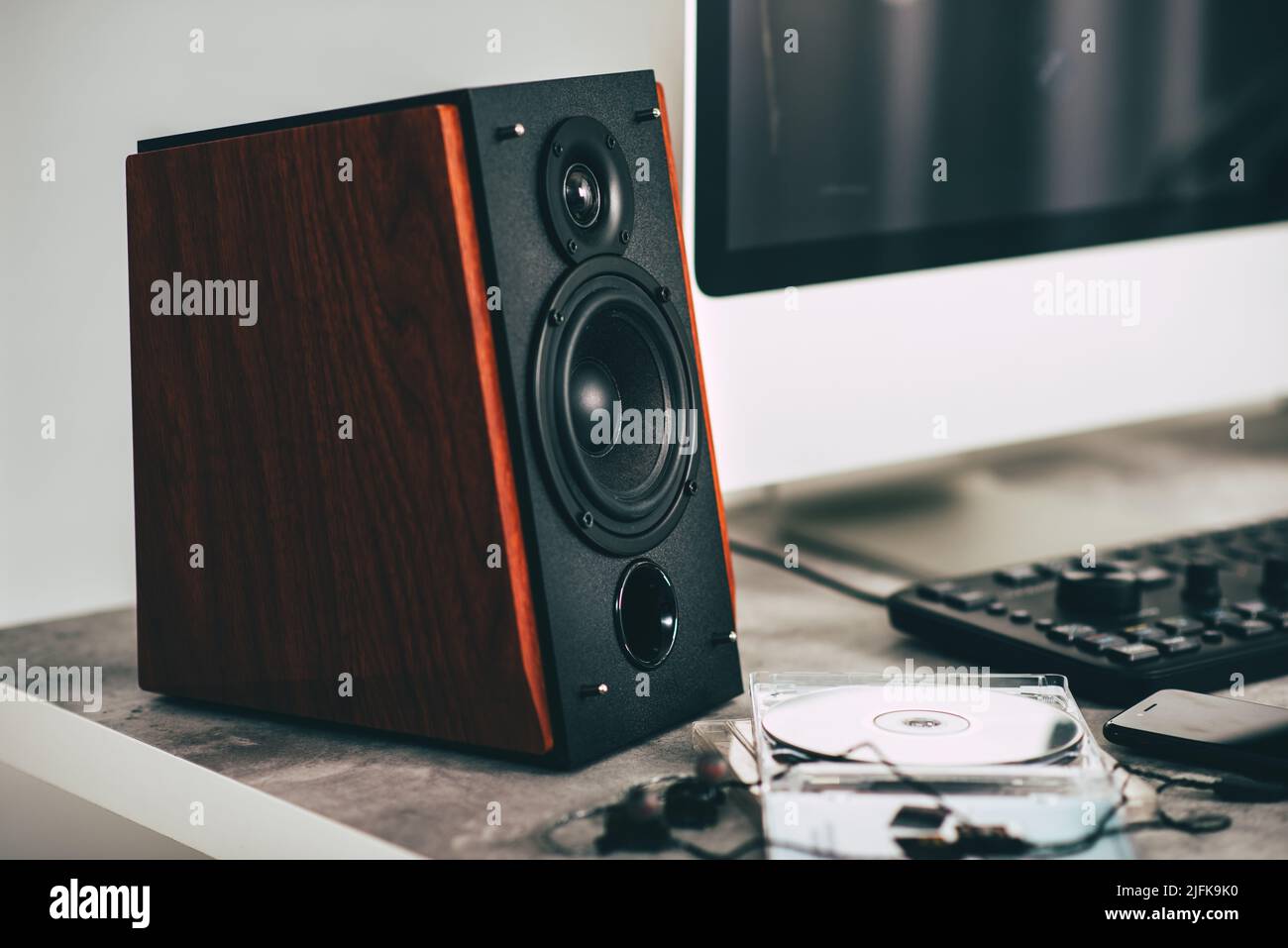 Workstation with speakers and computer in studio. Desktop in home