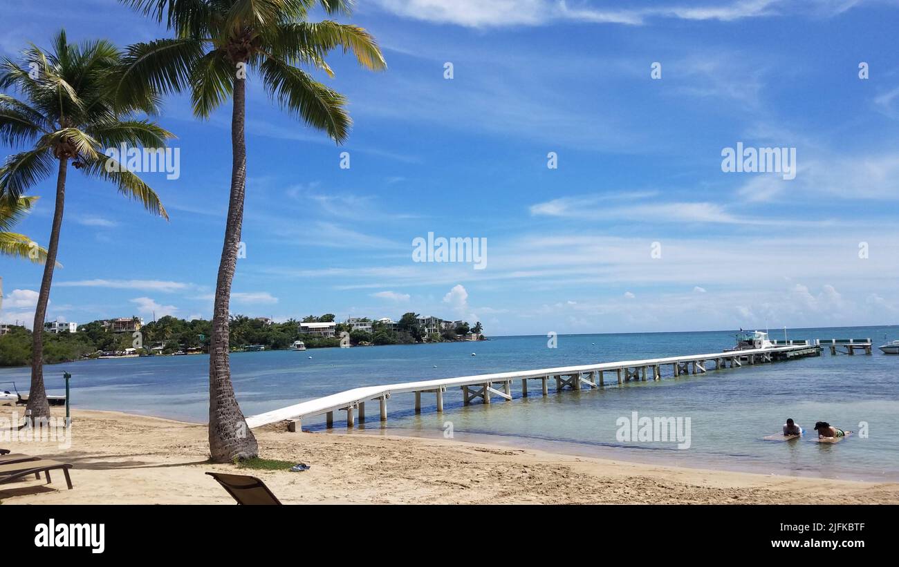 long white boardwalk or pier on calm sea water in Guanica, Puerto Rico