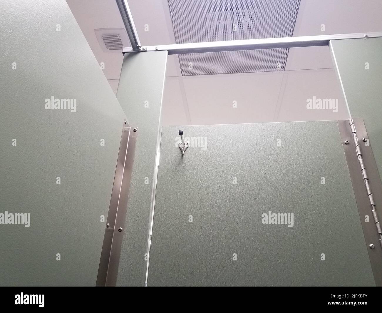 closed or locked bathroom or restroom stall door with coat rack or hook