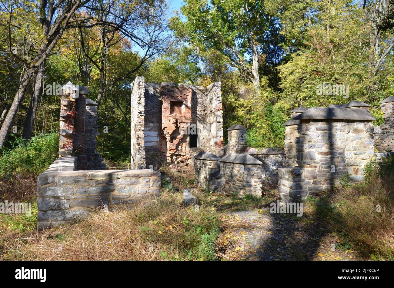 dilapidated brick and stone structure ruins and trees. Stock Photo