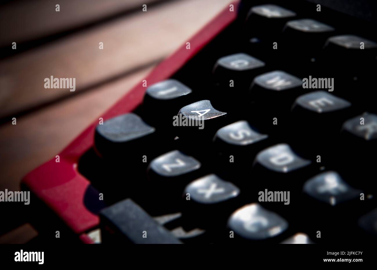 1970s dusty typewriter. Selective focus on key A. Stock Photo