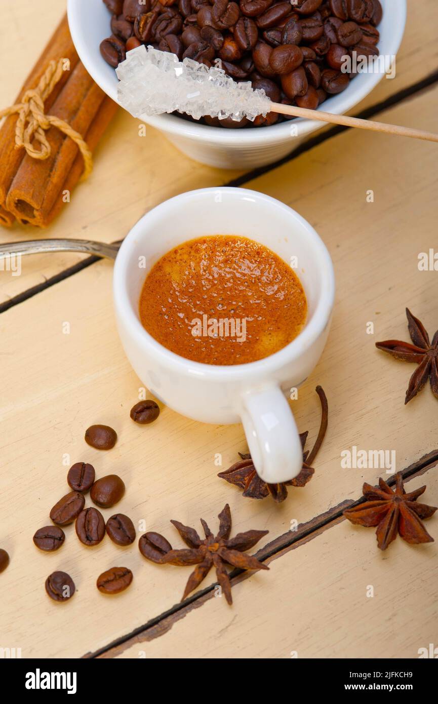 espresso coffee over white wood rustic table with sugar and spice. Stock Photo