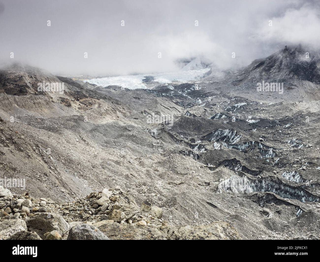 Low May clouds over the Khumbu glacier near Gorak Shep. The  Khumbu Icefall is the large white patch in the bg. Stock Photo