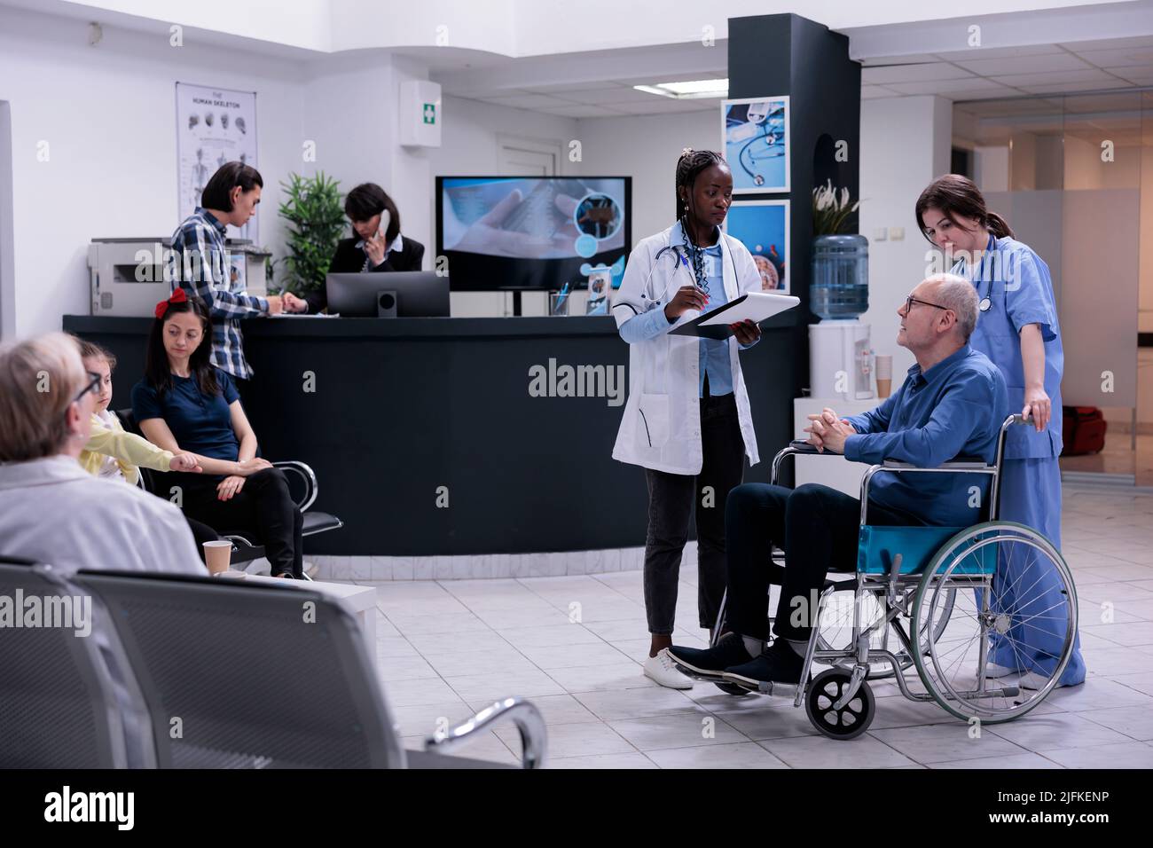 Retired person in wheelchair using hi res stock photography and images
