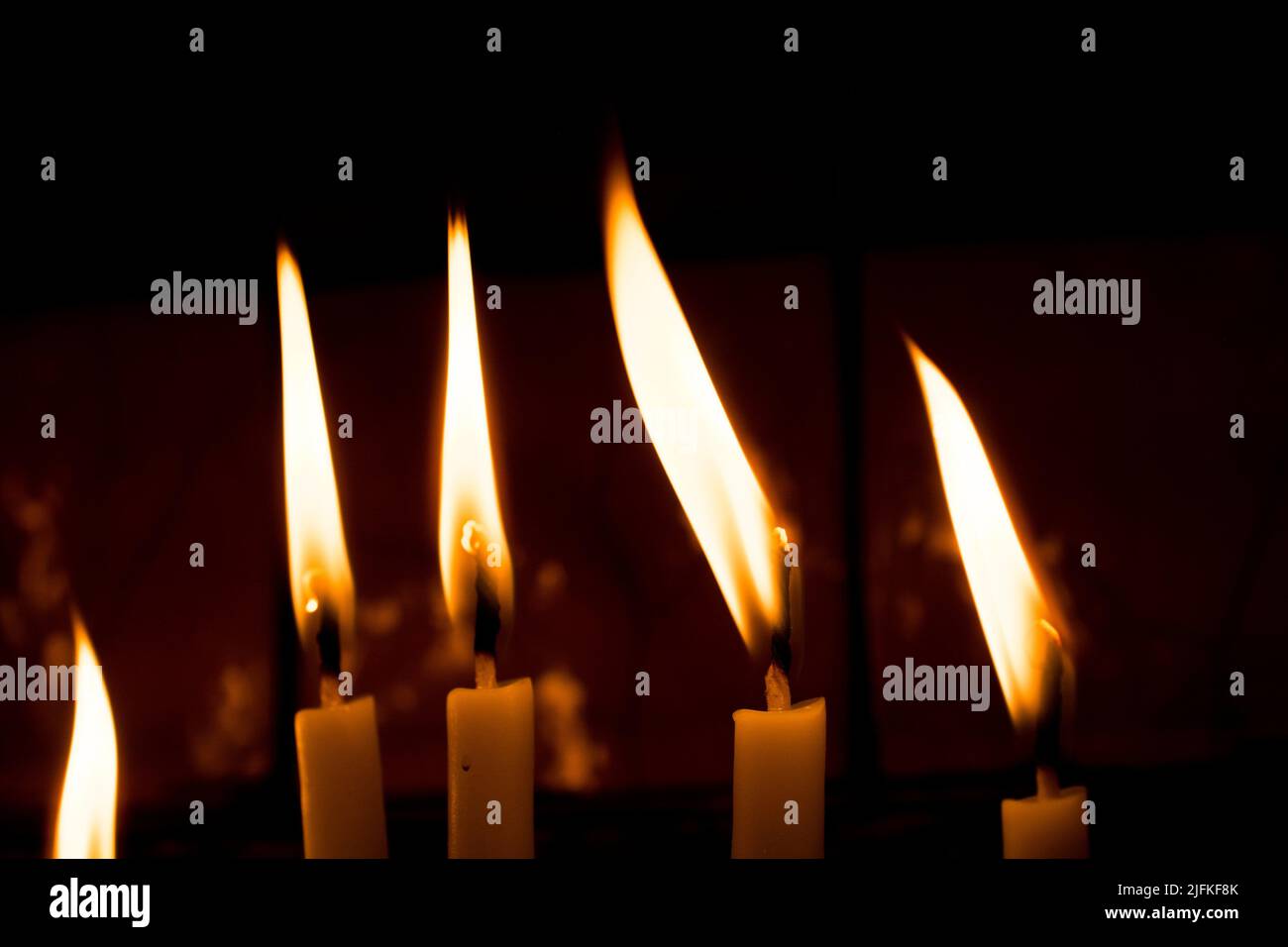 Burning candles with candle light in the dark Stock Photo Alamy