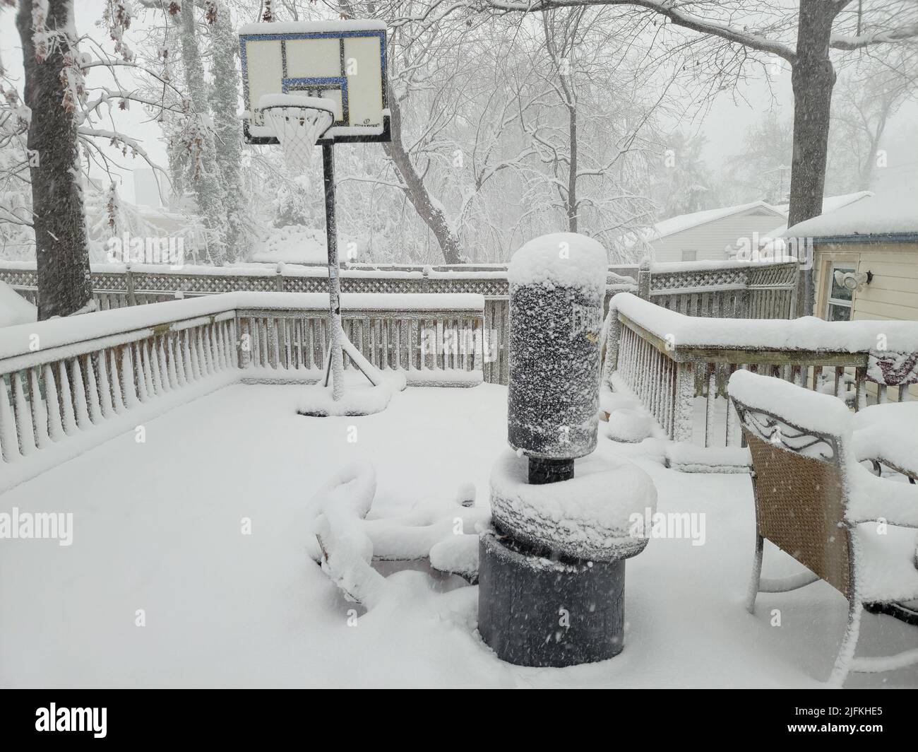 punching bag and basketball hoop on deck covered in snow in winter. Stock Photo
