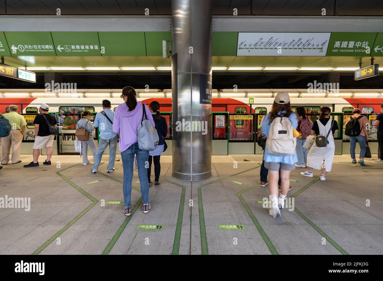 Taichung City, Taiwan - July 3, 2022 : Taichung MRT Metro system. Subway passengers waiting in Green line HSR Taichung station platform. Stock Photo