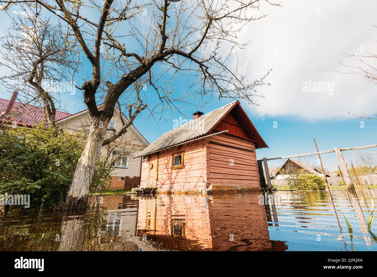 Sauna bath building In Water During Spring Flood floodwaters during natural disaster. Water deluge During A Spring Flood. inundation River. Stock Photo