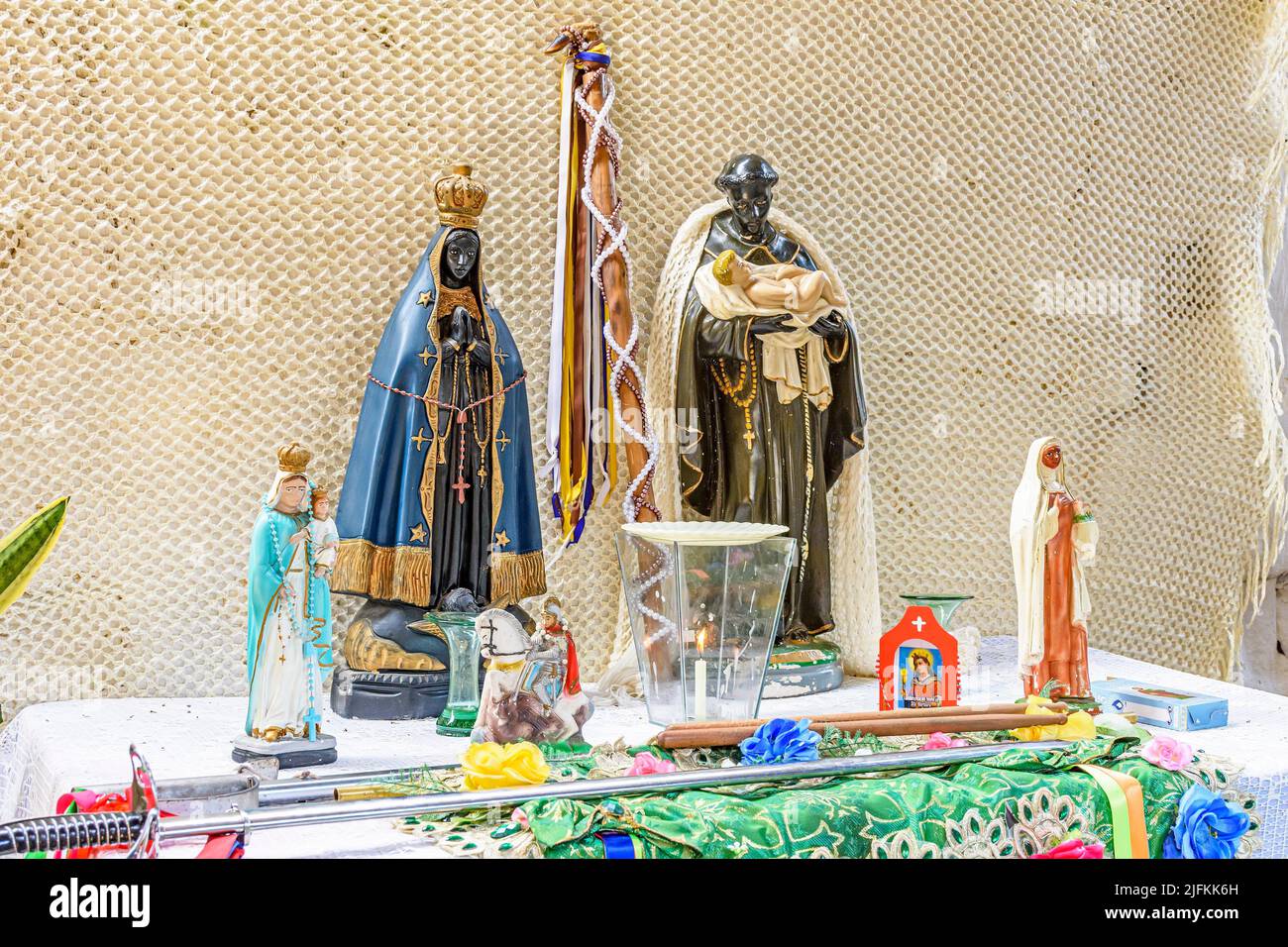 Brazilian religious altar mixing elements of umbanda, candomblé and catholicism in the syncretism present in the local culture and religion. Stock Photo