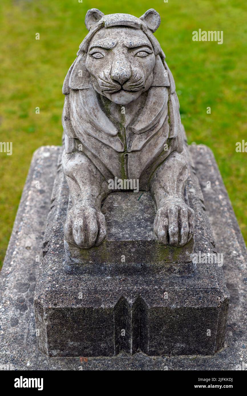 Small stone lion statue in the Stanley Park close to the Lions Gate