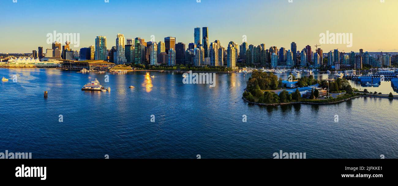 Panorama photo of Vancouver city at sunset, British Columbia, Canada. Photographed from the Stanley Park. Stock Photo